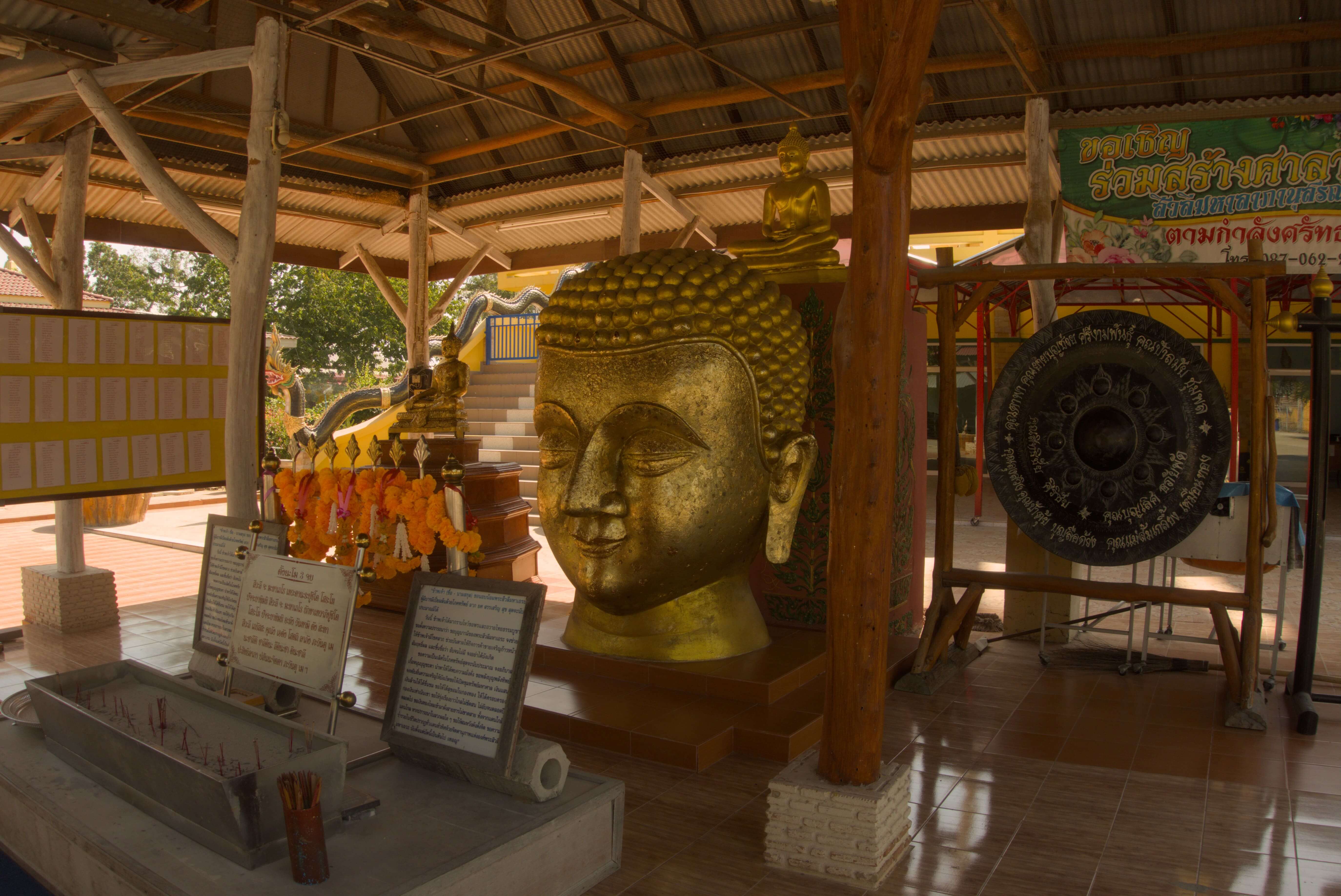 Temple in Thailand with Golden Buddha Head.